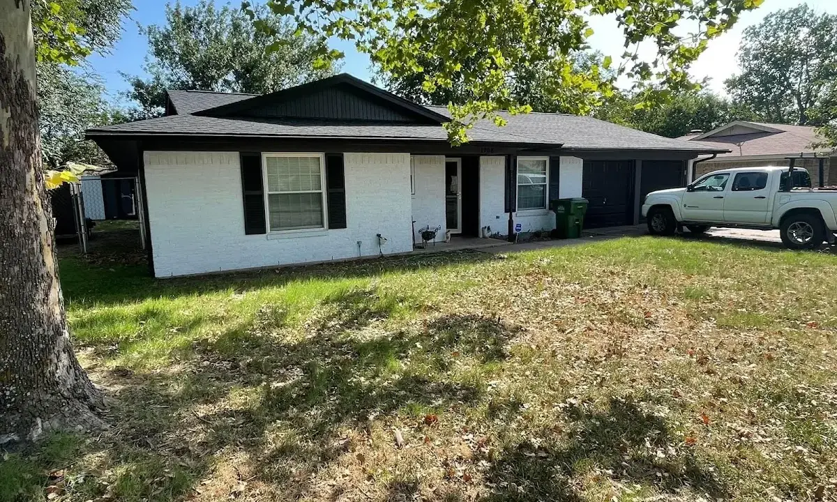 Professional roofing crew working on a residential roof in Swampscott